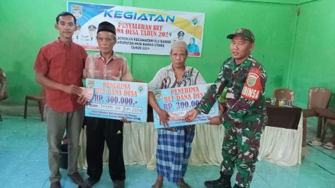 Babinsa Koramil 406-01/rawas ulu serda niki sudoyo Mengikuti Kegiatan Penyerahan (BLT-DD) Di Wilayah Binaan.