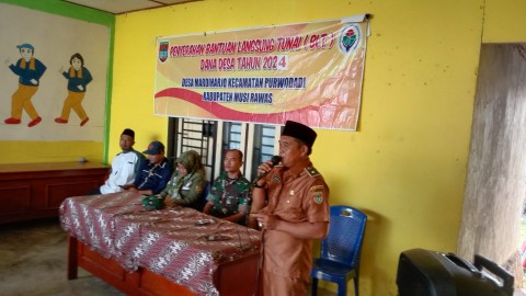 Danramil 406-06/Tugumulyo Hadiri dan Pastikan Keamanan dalam Pembagian BLT di Desa Mardiharjo